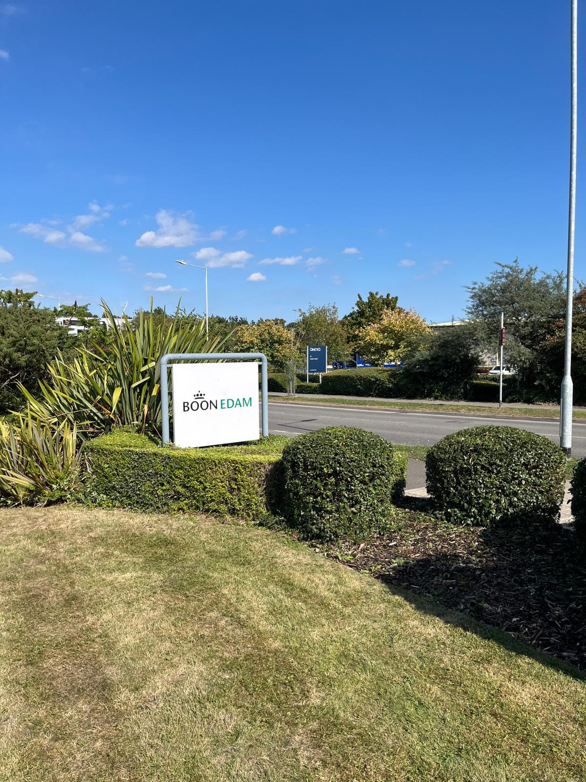 Commercial frontage with trimmed hedging