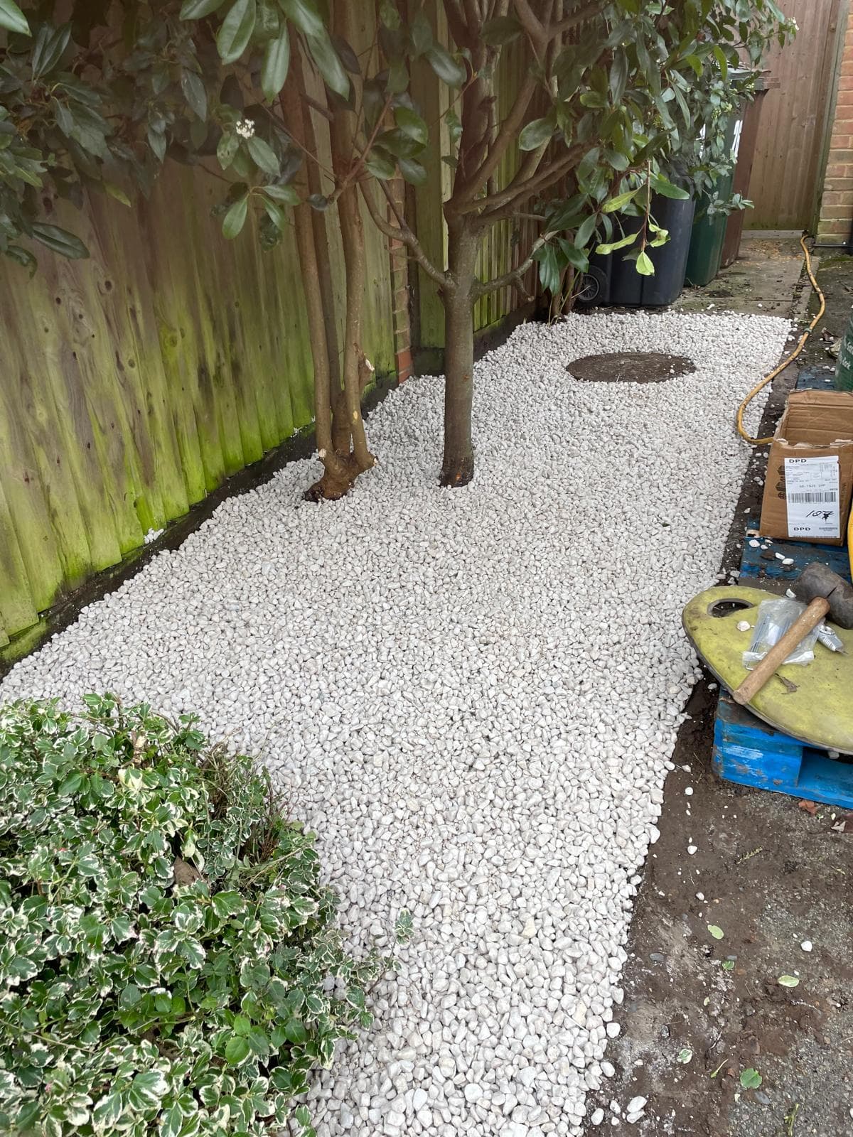 White gravel around tree bases